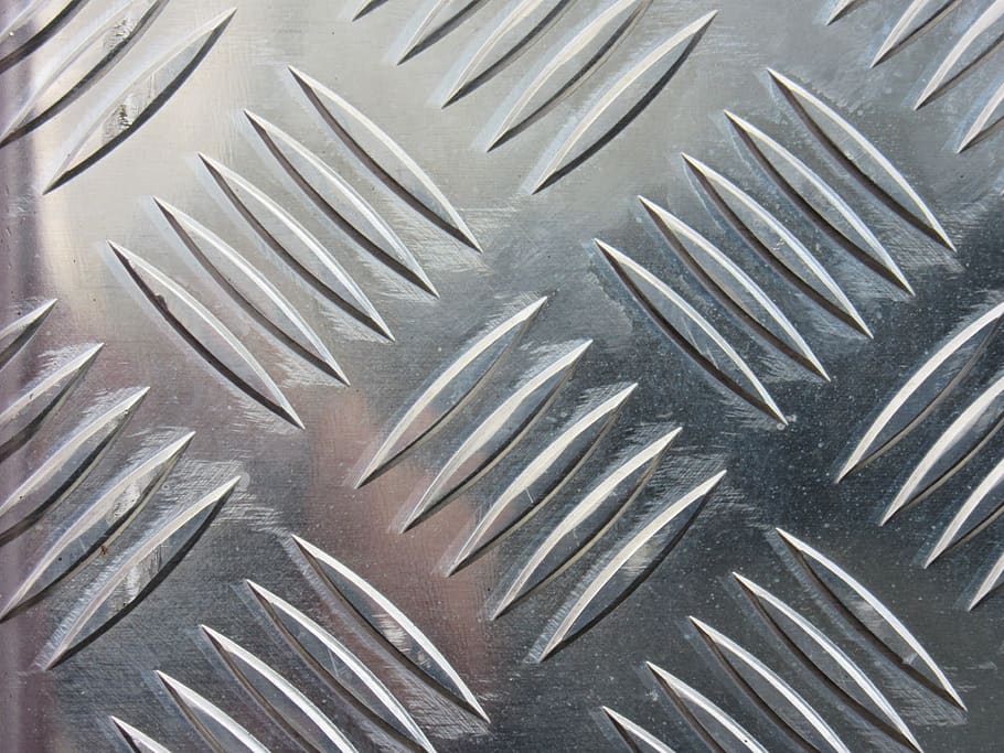 Sheet metal, often drilled using step drill bits.